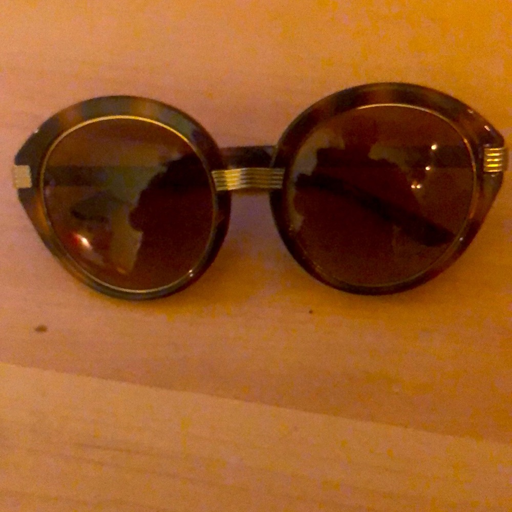 Tory Burch sunglasses small scratches so I’m pricing them low.